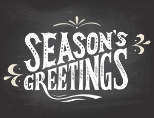 Season's greetings on chalkboard background
